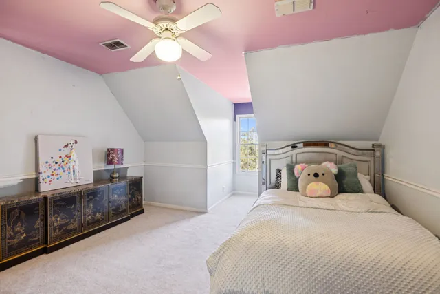 a view of a backyard with furniture and garden