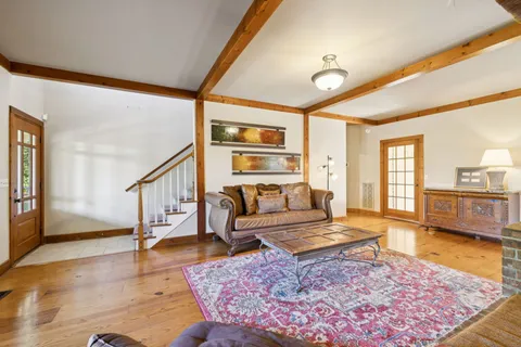 a living room with furniture and a rug