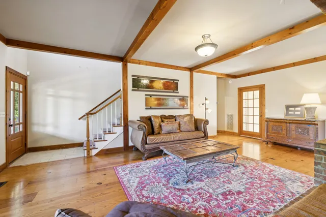 a living room with furniture and a rug