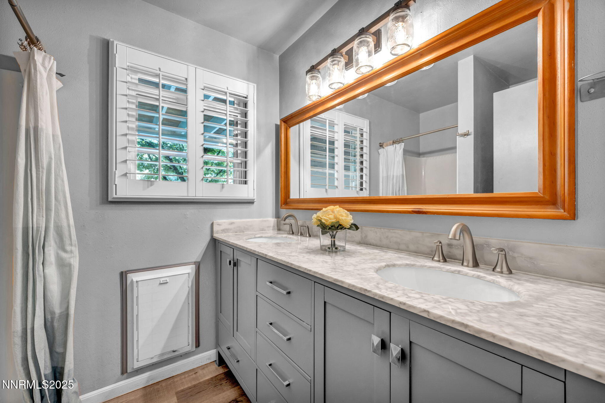 1478 Clough Road Reno, NV 89509 - Photo 14 of 32 a bathroom with a granite countertop sink and a window