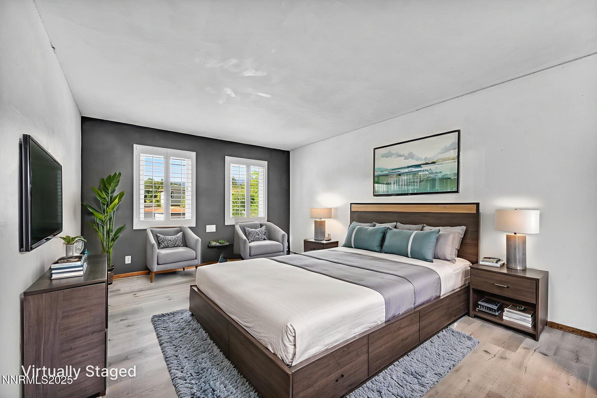 1478 Clough Road Reno, NV 89509 - Photo 17 of 32 a bedroom with double bed and a flat screen tv