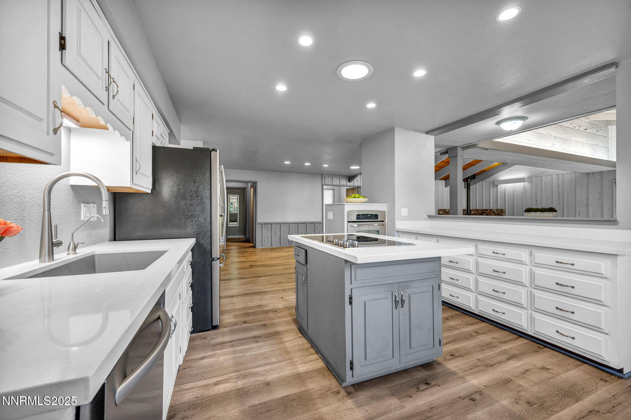 1478 Clough Road Reno, NV 89509 - Photo 2 of 32 a kitchen with white cabinets and sink