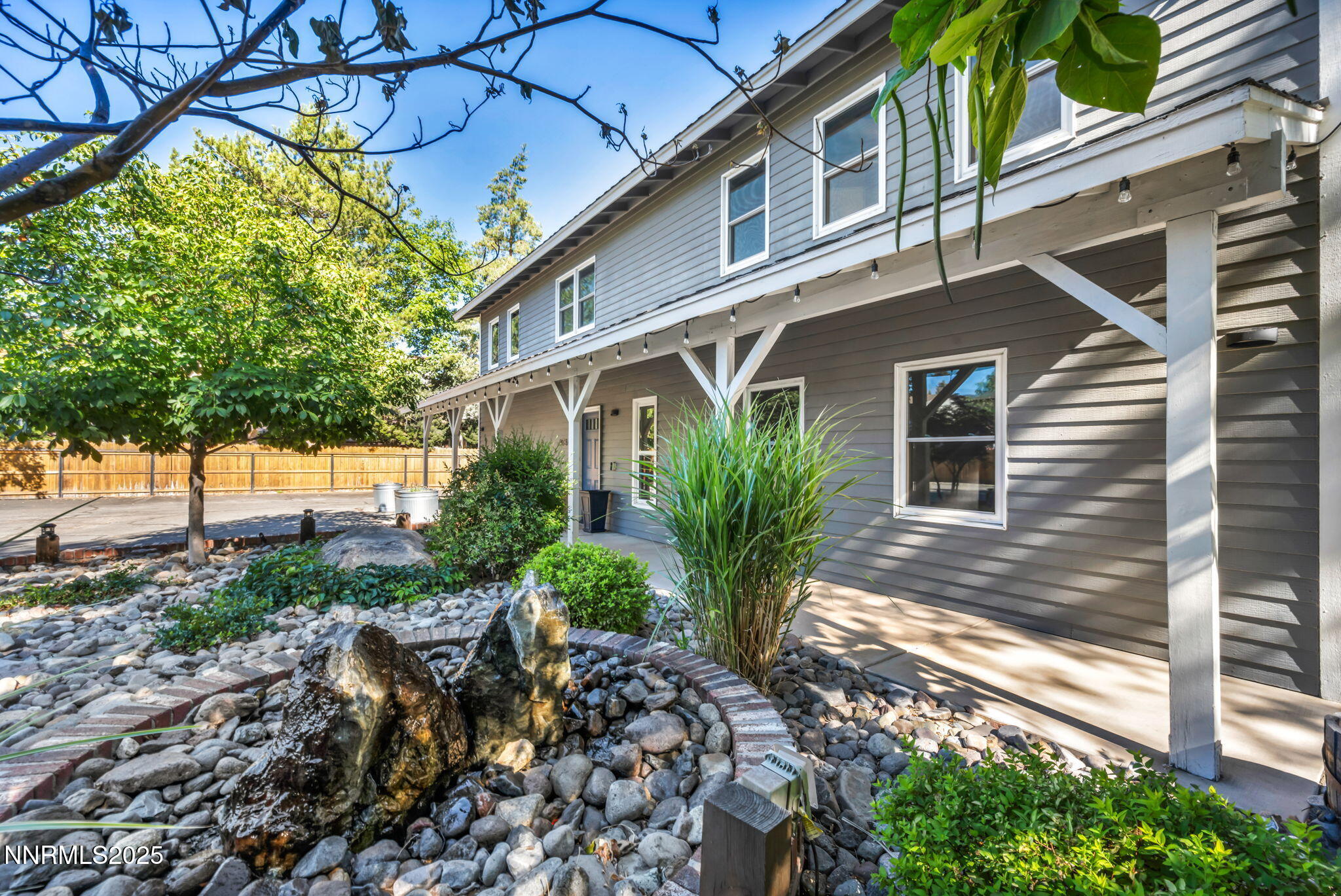 1478 Clough Road Reno, NV 89509 - Photo 23 of 32 a view of a house with a yard and potted plants