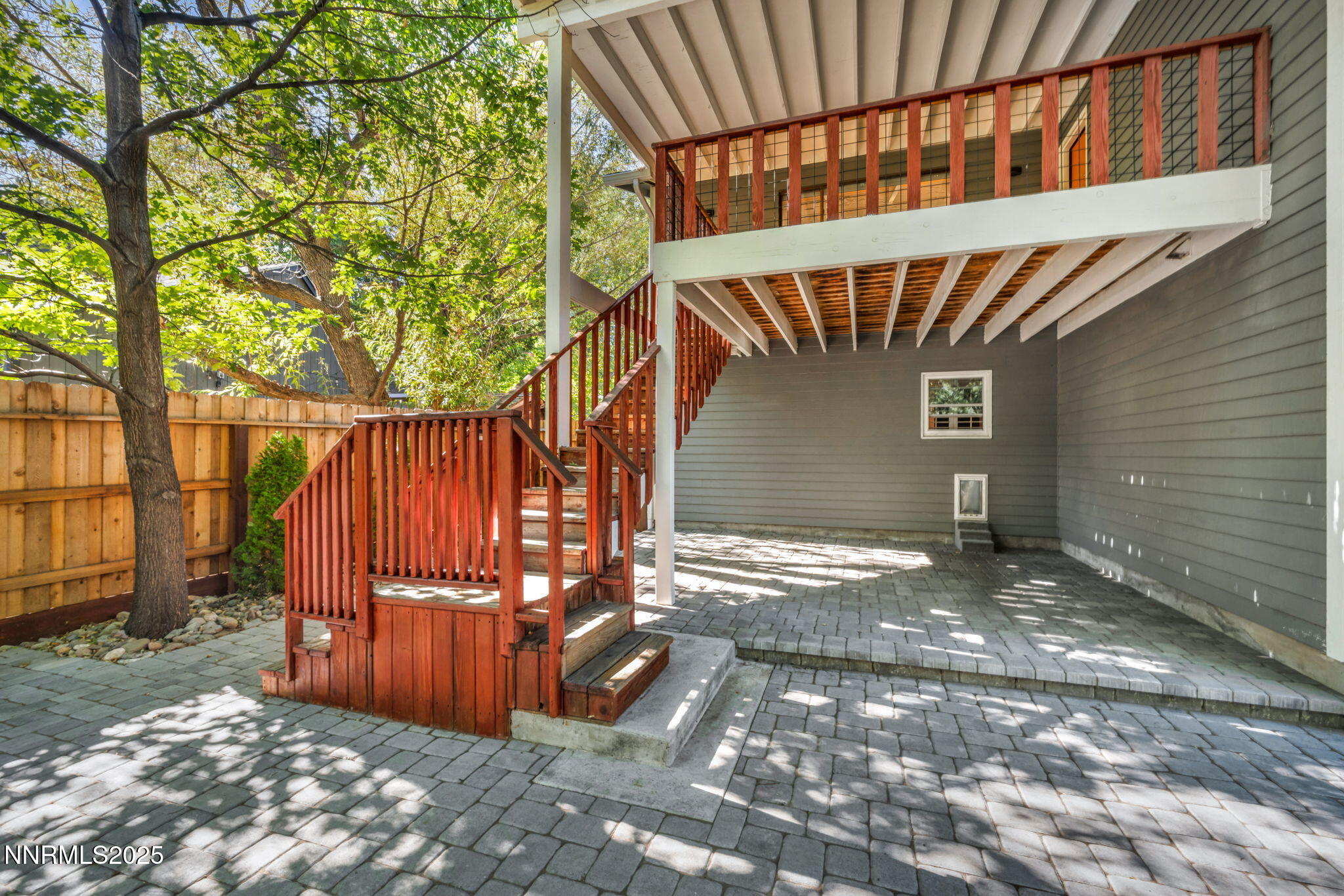 1478 Clough Road Reno, NV 89509 - Photo 27 of 32 a view of a backyard with wooden fence and large trees