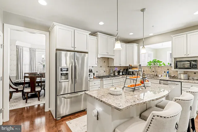 a bathroom with a toilet a sink and a mirror