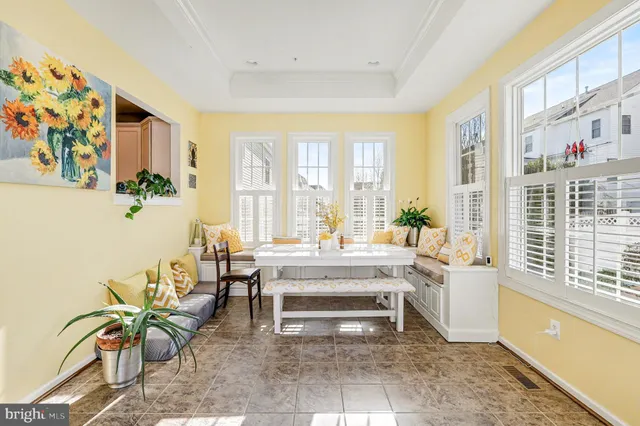 a spacious bedroom with a bed and wooden floor
