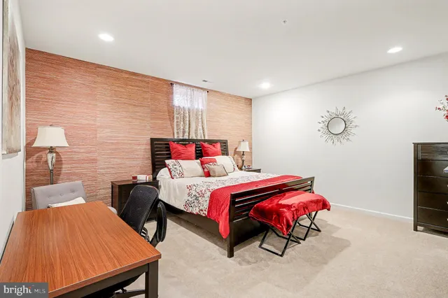 a bathroom with a sink vanity mirror and toilet