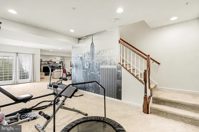 a living room with furniture a projector and a flat screen tv