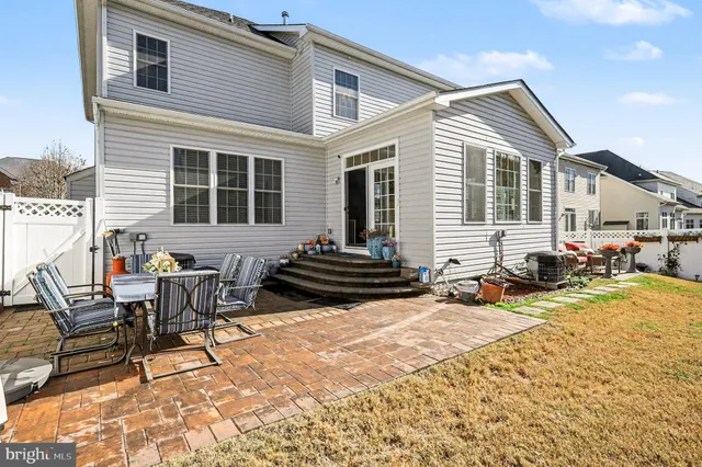 a view of balcony with wooden floor and fence