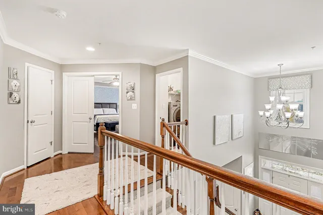 a living room with furniture and a view of kitchen