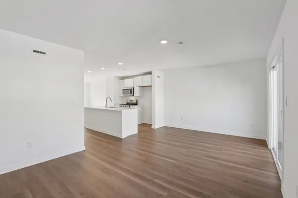 a view of kitchen with wooden floor