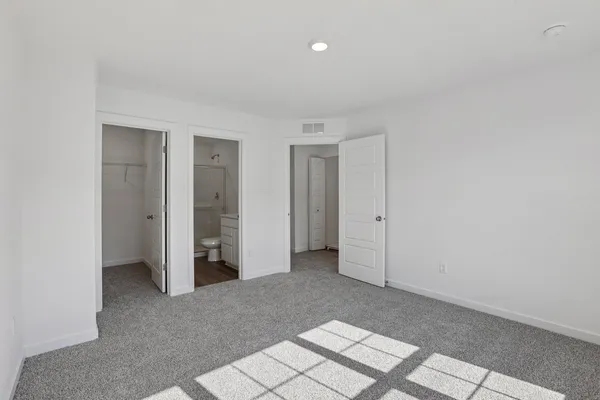 an empty room with a bathroom