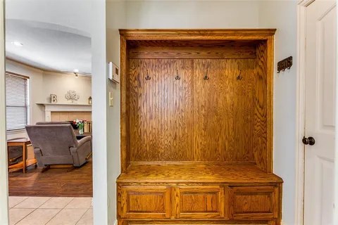 a spacious bedroom with a bed and a ceiling fan