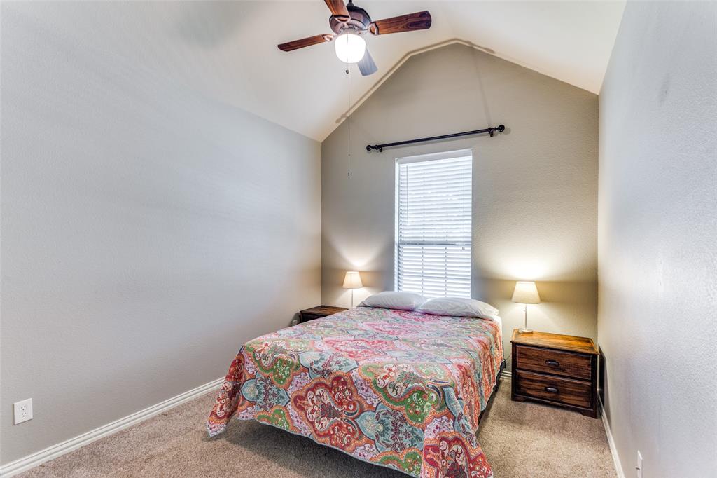 400 Commonwealth Drive Saginaw, TX 76179 - Photo 18 of 32 a bedroom with a bed and a window