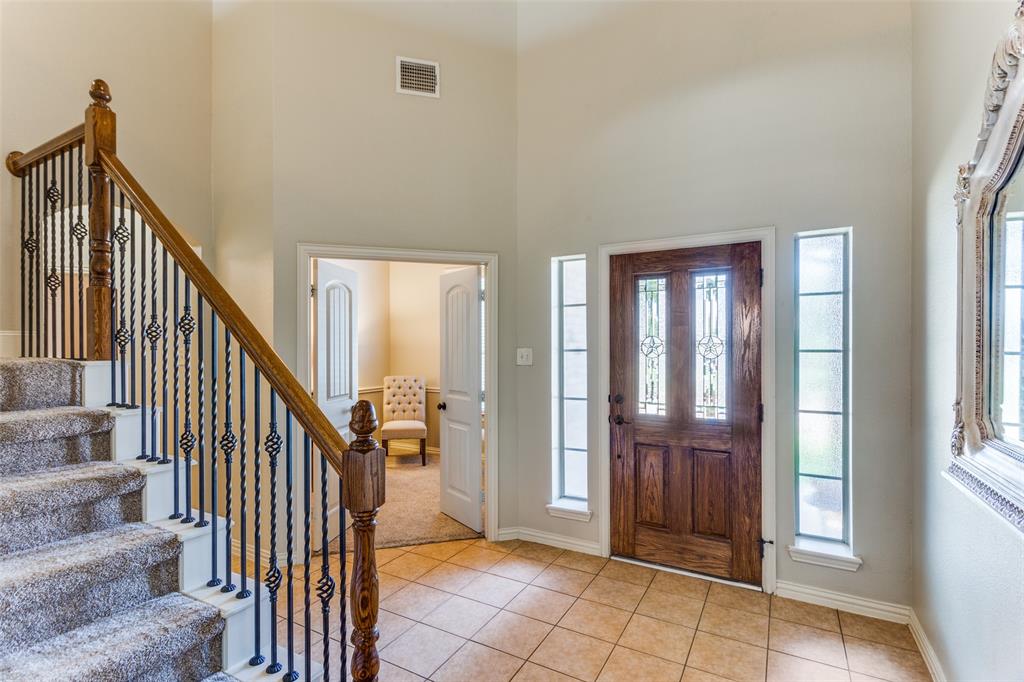400 Commonwealth Drive Saginaw, TX 76179 - Photo 20 of 32 a view of an entryway with staircase