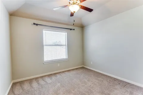 a view of a house with a yard and garage