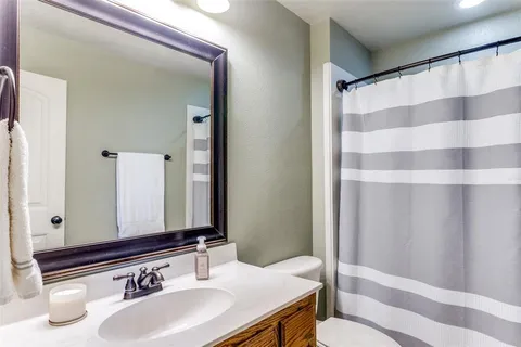 a house view with a play ground in front of it