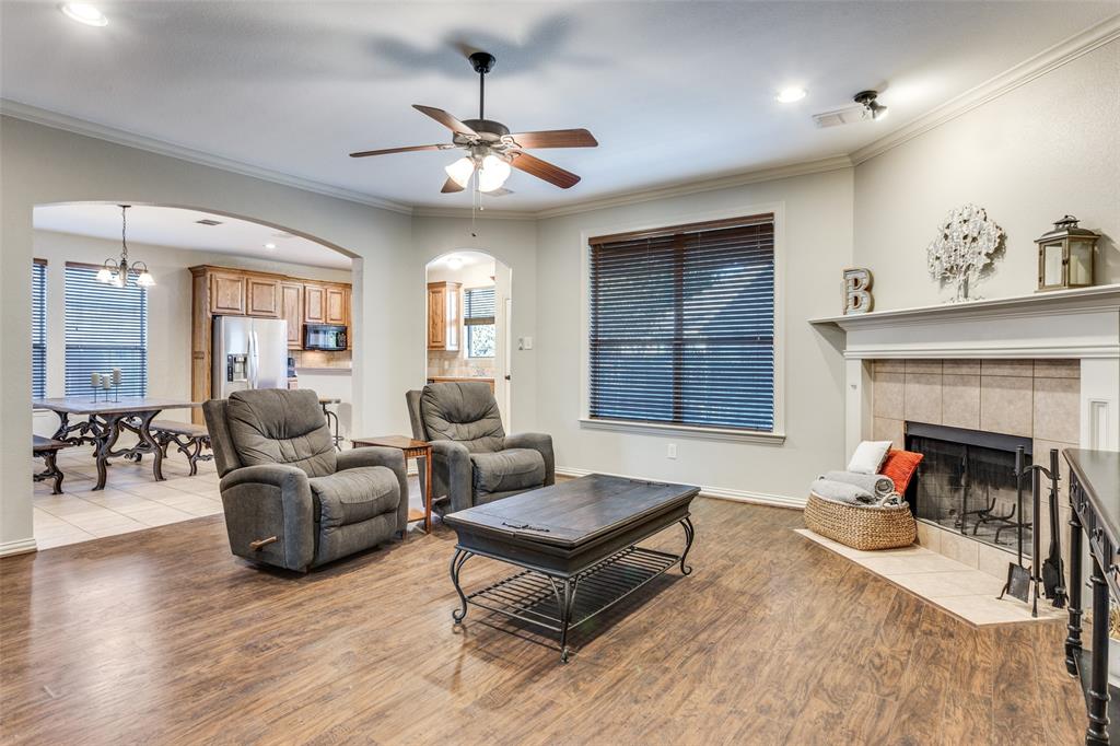 400 Commonwealth Drive Saginaw, TX 76179 - Photo 5 of 32 a living room with furniture and a fireplace