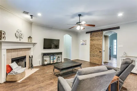 a living room with furniture and a fireplace