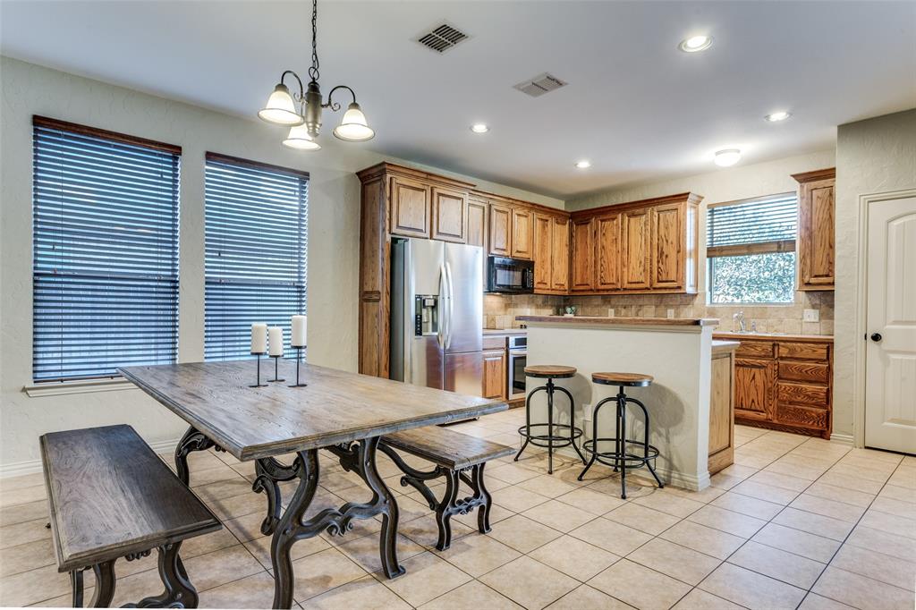 400 Commonwealth Drive Saginaw, TX 76179 - Photo 10 of 32 a view of a dining room with furniture