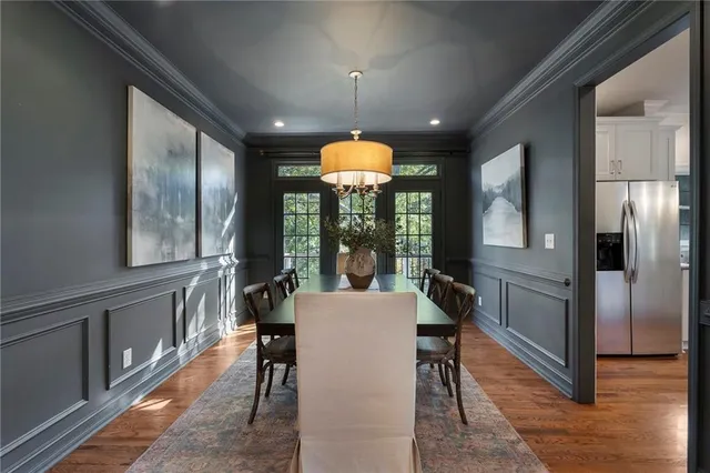 a bathroom with a sink mirror and toilet