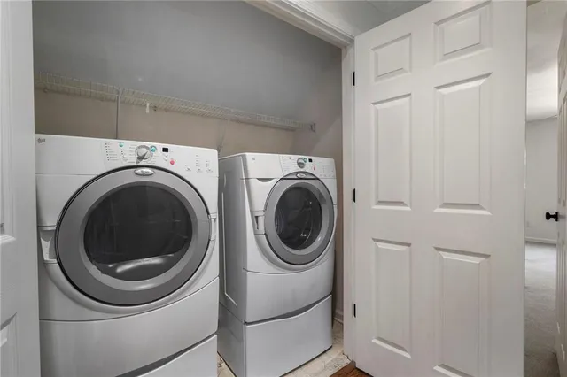 a view of a balcony with a floor to ceiling window and wooden floor