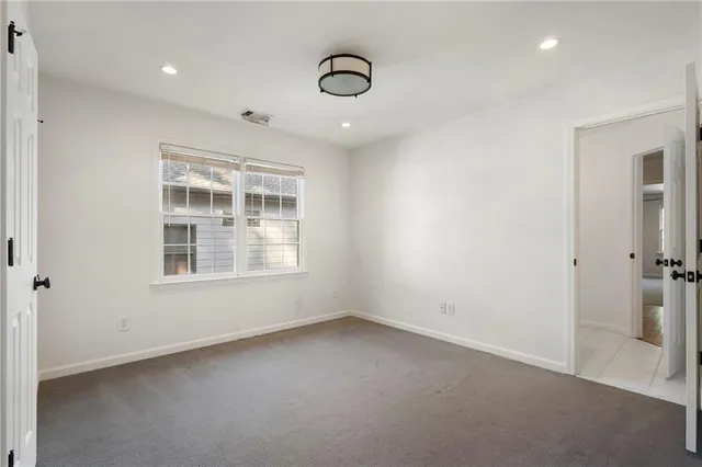 a view of balcony with wooden floor and fence
