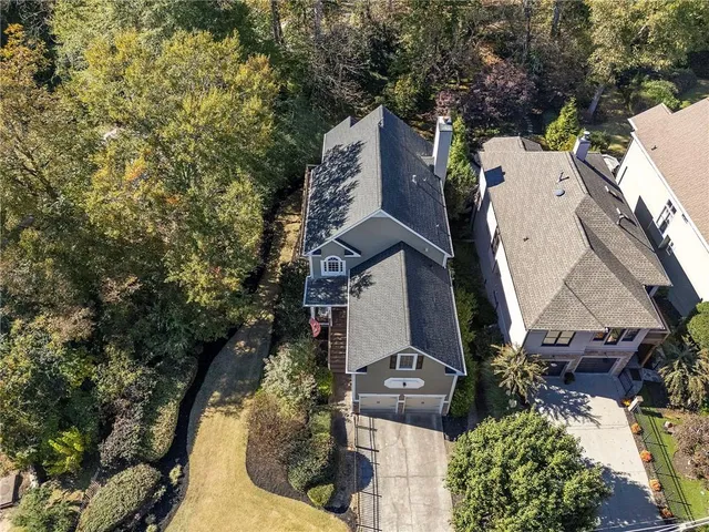 an aerial view of a house with outdoor space