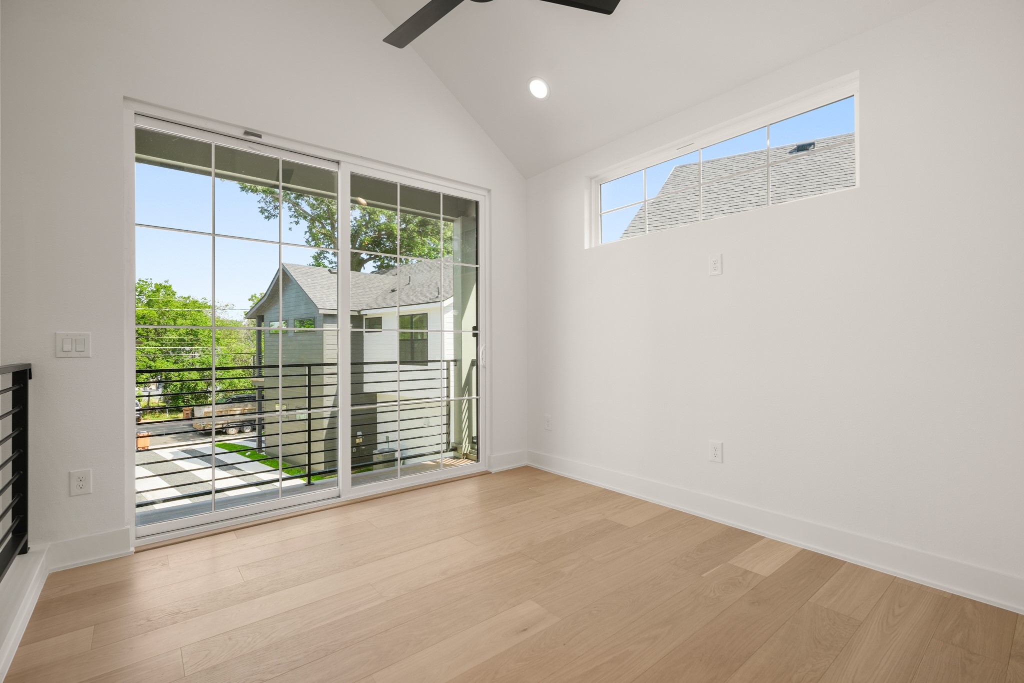 601 Vermont Road, Unit 2 Austin, TX 78702 - Photo 24 of 31 Hardwood floors and a vaulted ceiling create an airy bedroom with abundant natural light.
