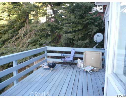 26547 Valley View Lake Rimforest, CA 92378 - Photo 3 of 4 a balcony with wooden floor and outdoor seating