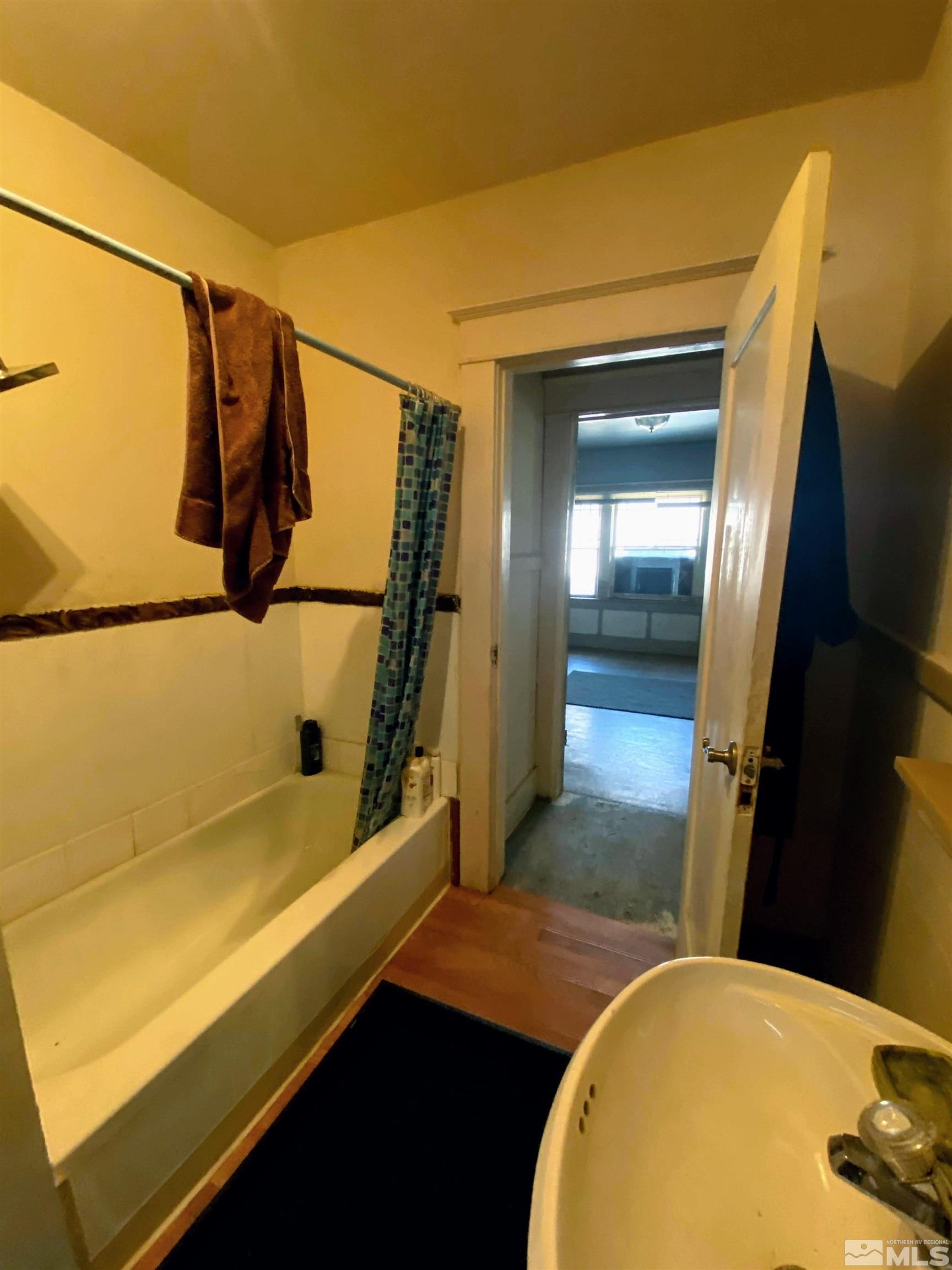 650 Spokane Street Reno, NV 89512 - Photo 14 of 25 a bathroom with a sink and a mirror