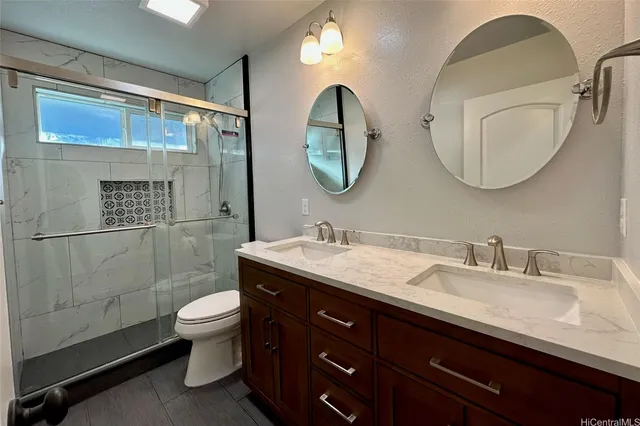 a bathroom with a double vanity sink and a mirror