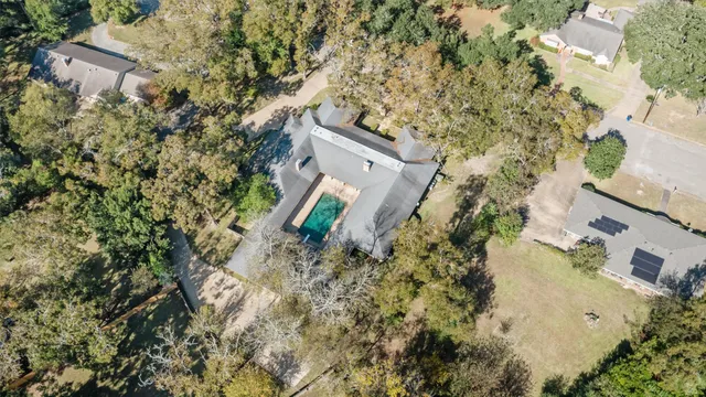 an aerial view of a house with a yard