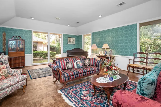 a living room with fireplace furniture and a flat screen tv
