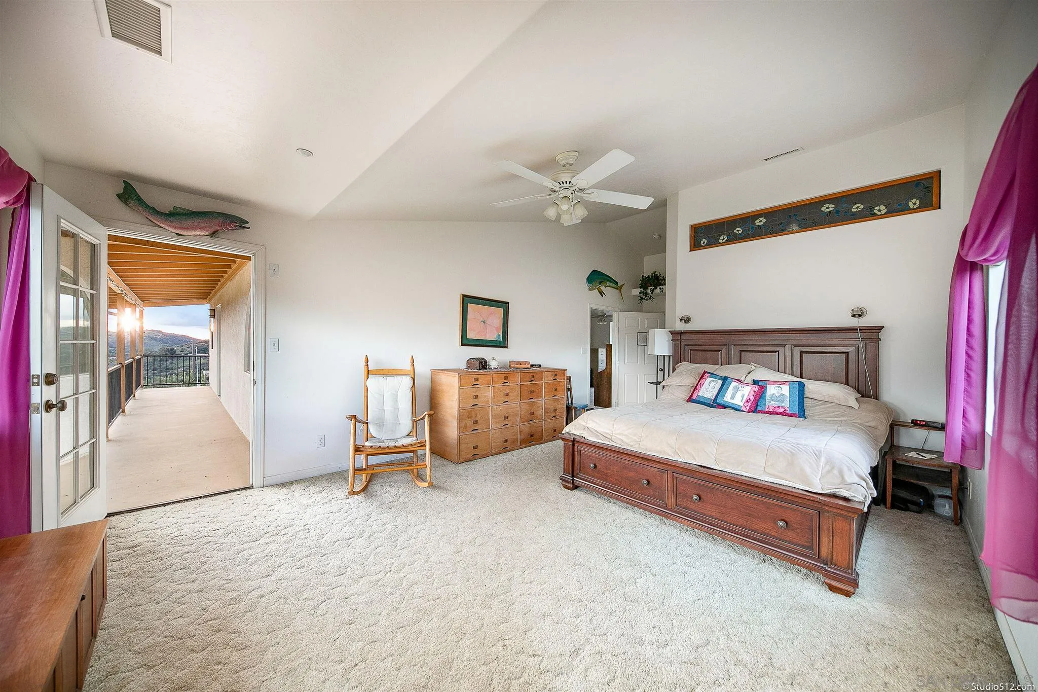13190 Dermid Road Valley Center, CA 92082 - Photo 17 of 36 a bedroom with a bed and a chandelier