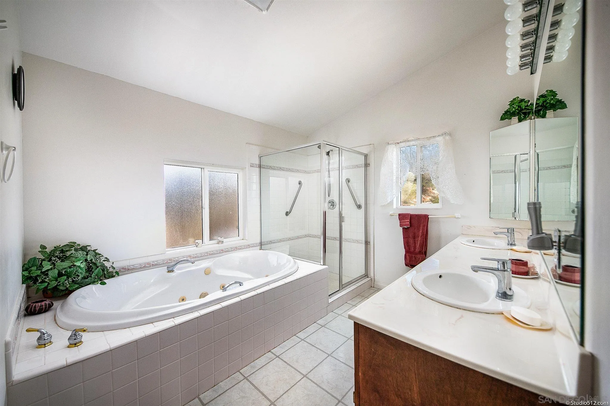 13190 Dermid Road Valley Center, CA 92082 - Photo 18 of 36 a bathroom with a tub sink and mirror