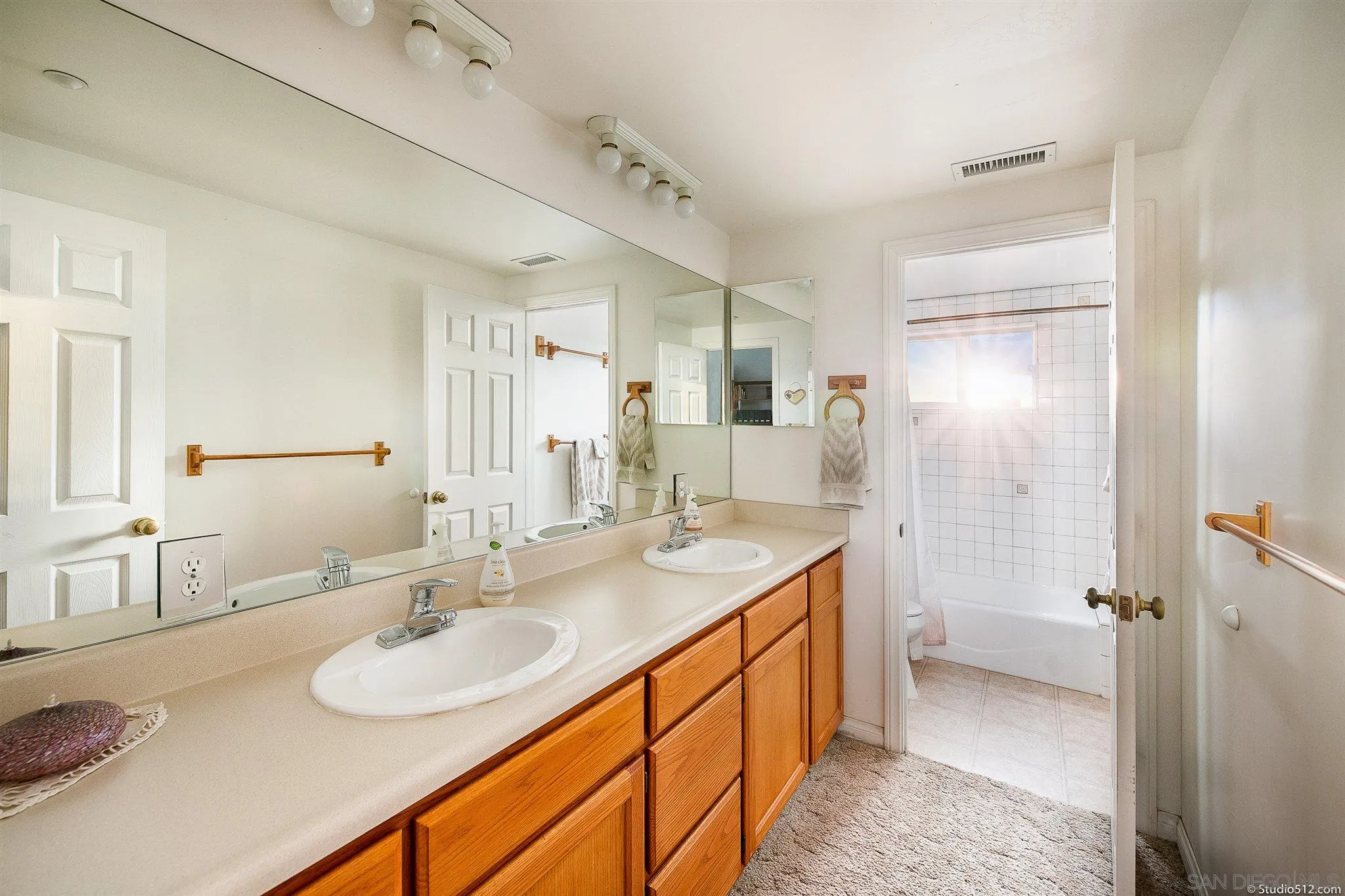 13190 Dermid Road Valley Center, CA 92082 - Photo 22 of 36 a bathroom with a sink double vanity granite tub shower and a mirror