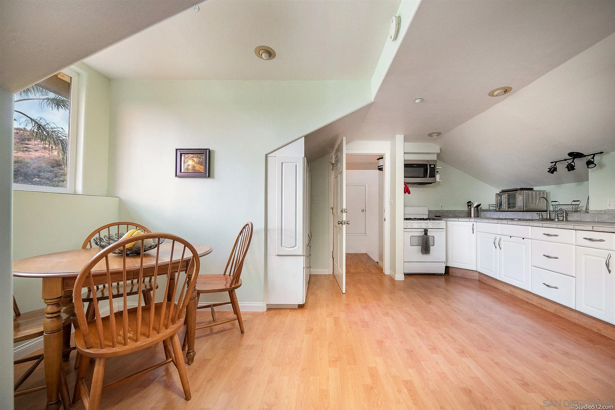 13190 Dermid Road Valley Center, CA 92082 - Photo 23 of 36 a kitchen with a sink cabinets and wooden floor