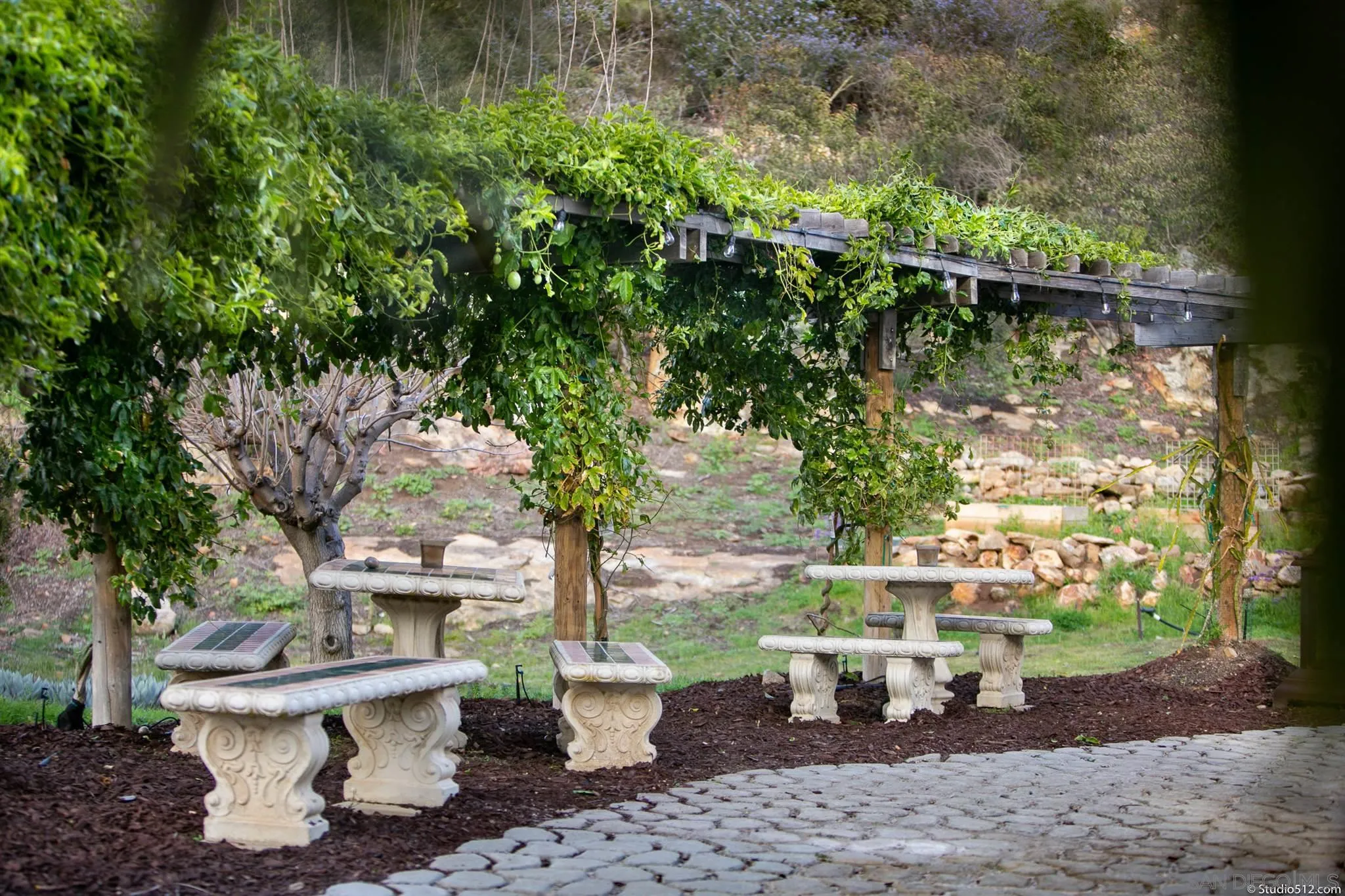 13190 Dermid Road Valley Center, CA 92082 - Photo 29 of 36 a view of a patio with table and chairs plants and trees