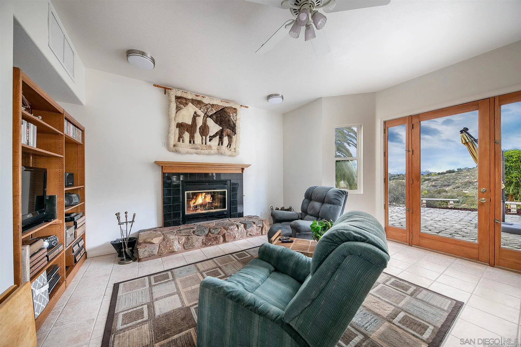 13190 Dermid Road Valley Center, CA 92082 - Photo 7 of 36 a living room with furniture and a fireplace