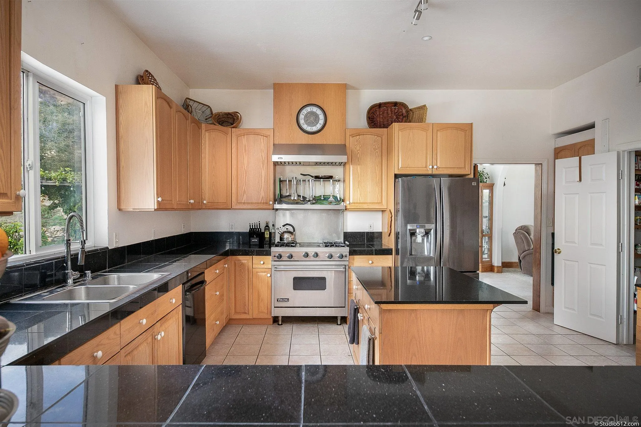 13190 Dermid Road Valley Center, CA 92082 - Photo 10 of 36 a kitchen with a refrigerator and a sink