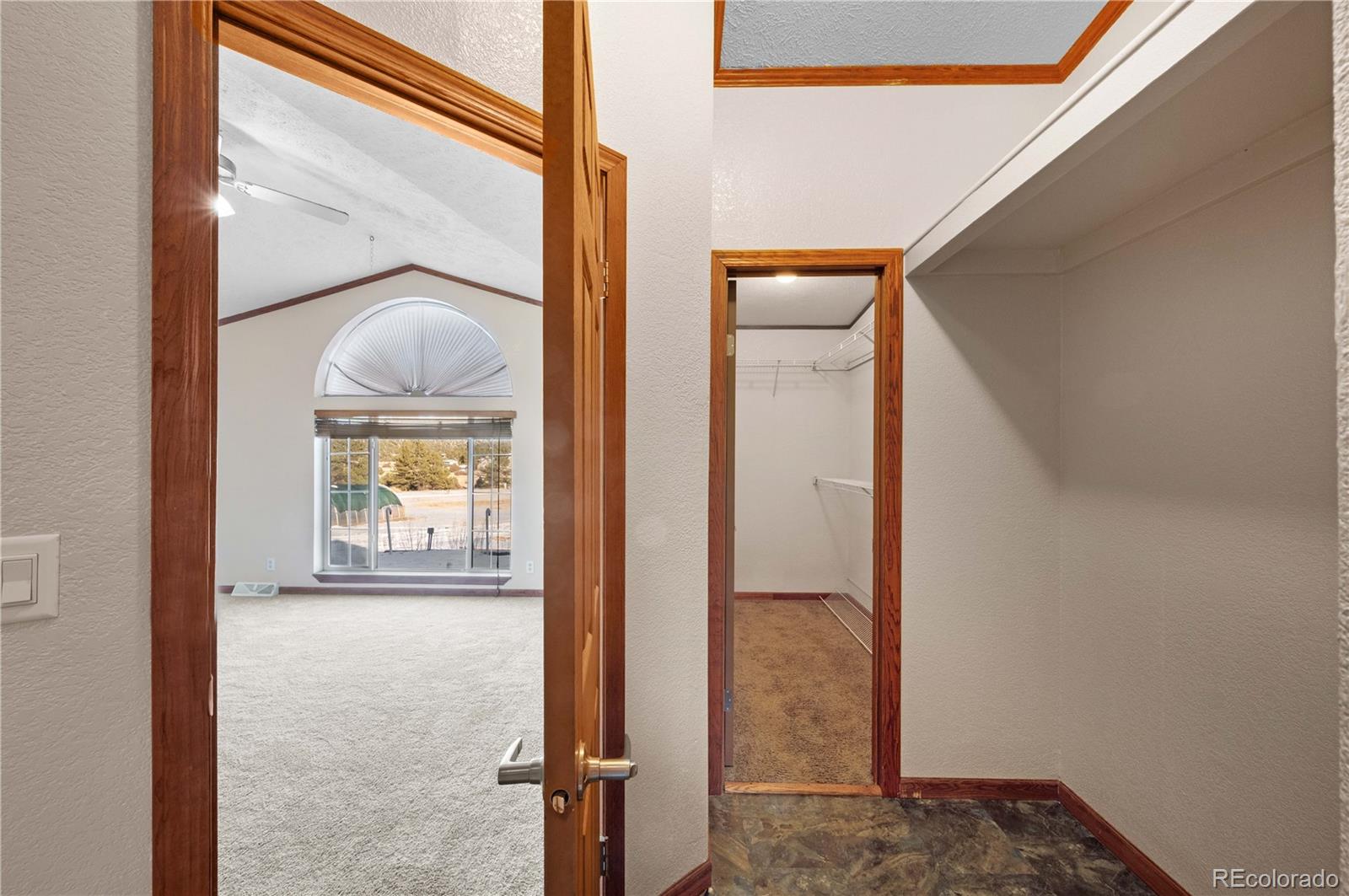 7191 Copper Gulch Road Cotopaxi, CO 81223 - Photo 29 of 50 a view of a hallway with wooden floor and a living room