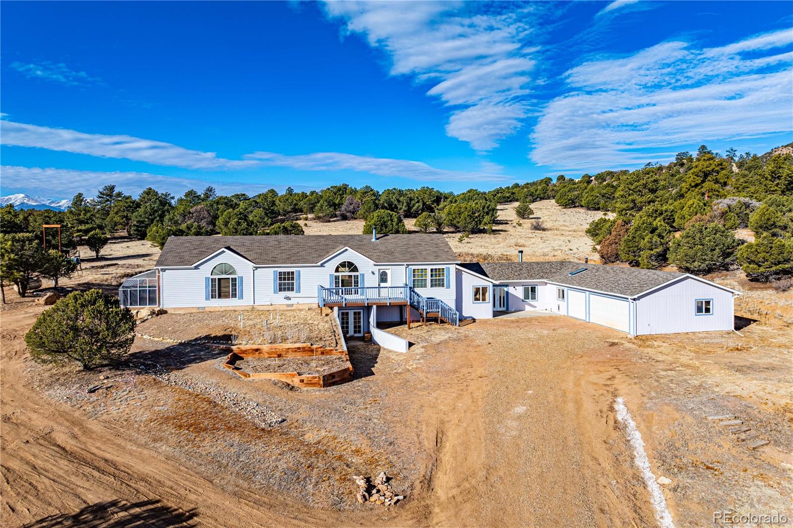 7191 Copper Gulch Road Cotopaxi, CO 81223 - Photo 3 of 50 a view of a house with a yard