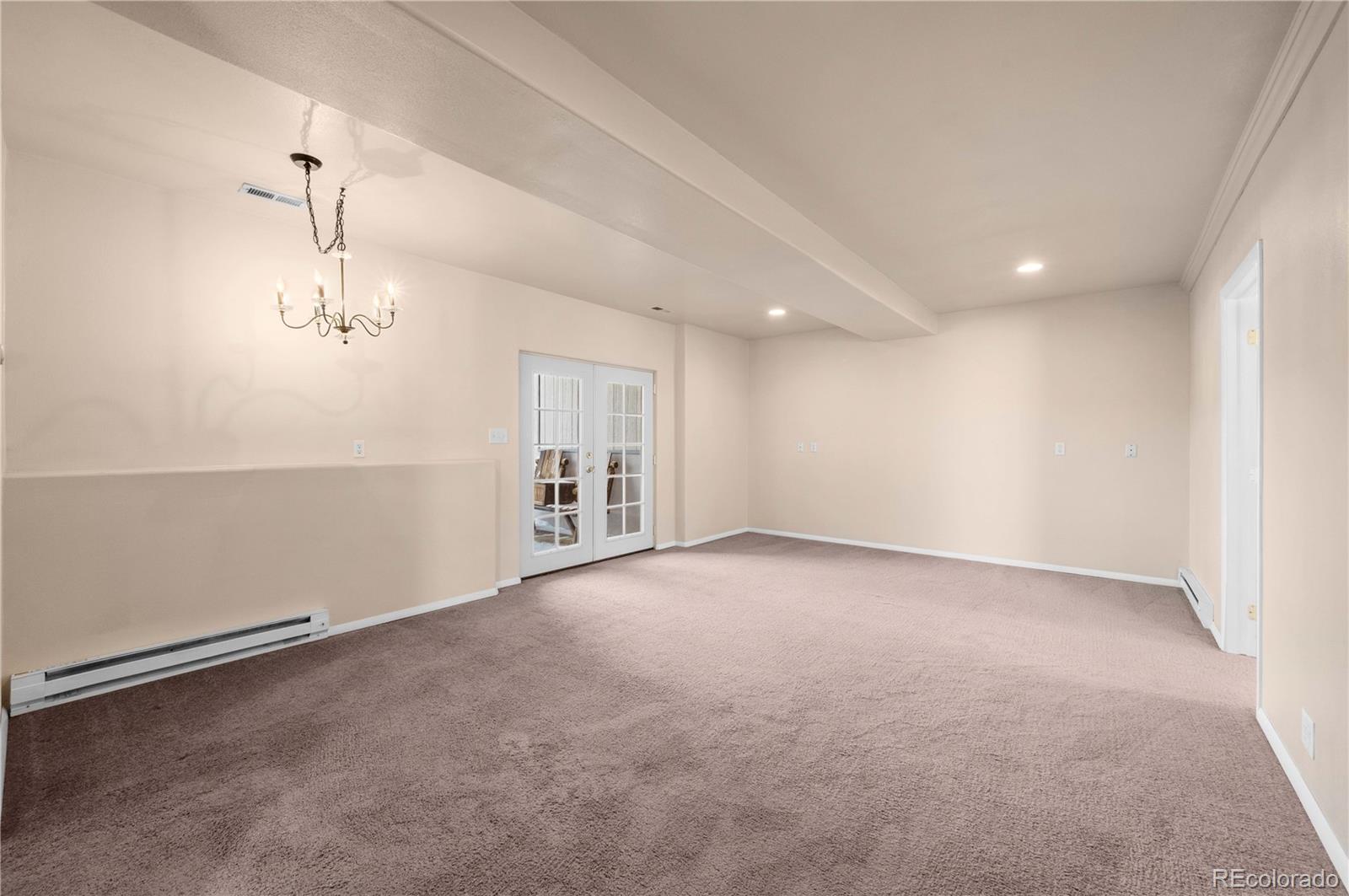 7191 Copper Gulch Road Cotopaxi, CO 81223 - Photo 38 of 50 an empty room with windows and ceiling fan