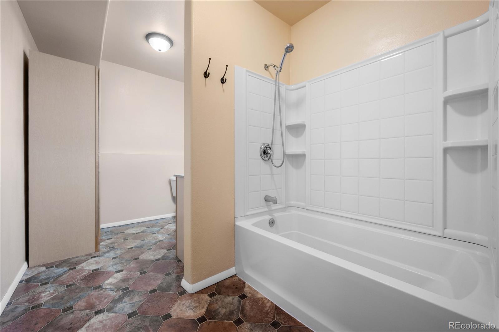 7191 Copper Gulch Road Cotopaxi, CO 81223 - Photo 40 of 50 a white bath tub sitting next to a shower