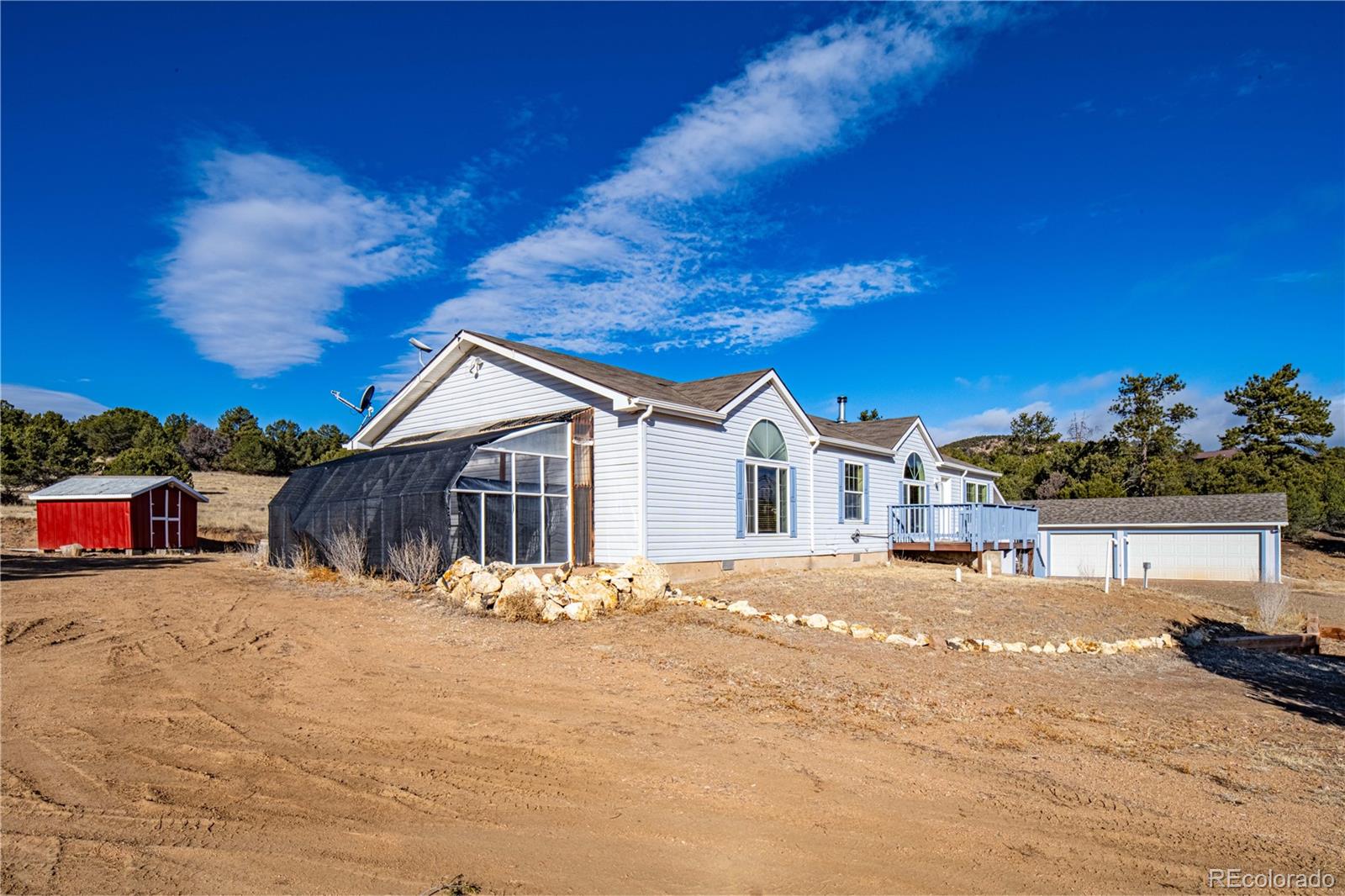 7191 Copper Gulch Road Cotopaxi, CO 81223 - Photo 5 of 50 a view of a house with a yard covered in snow