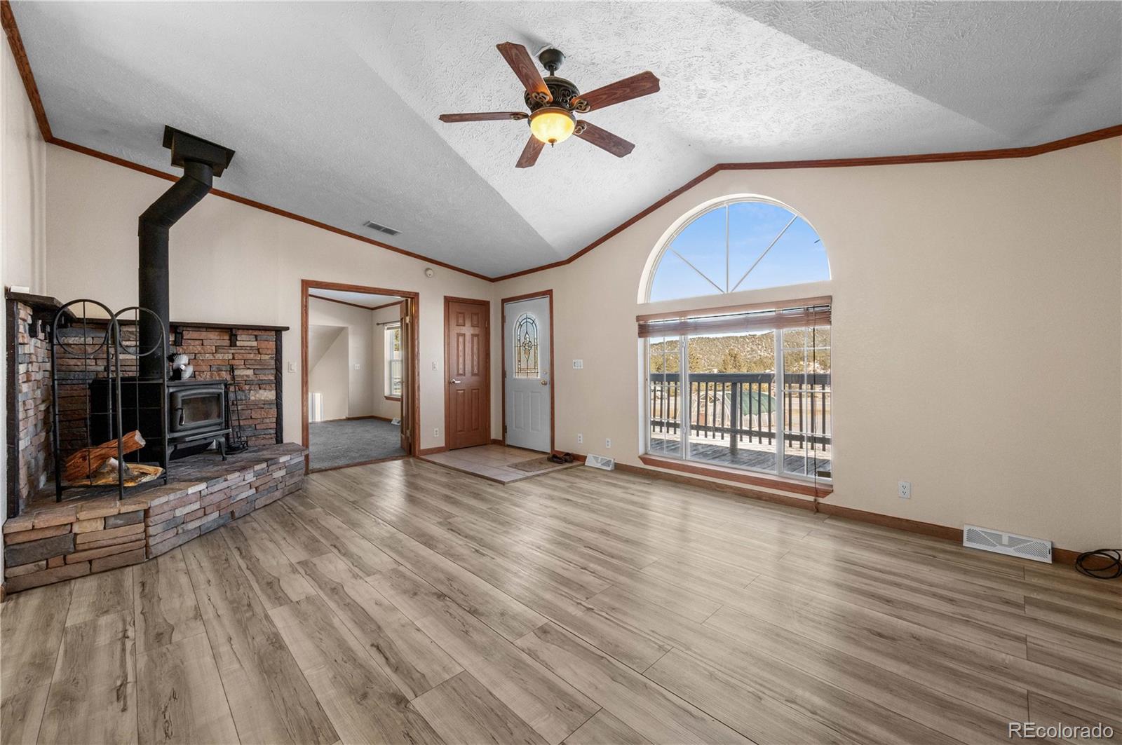 7191 Copper Gulch Road Cotopaxi, CO 81223 - Photo 8 of 50 a view of n empty room with window and wooden floor