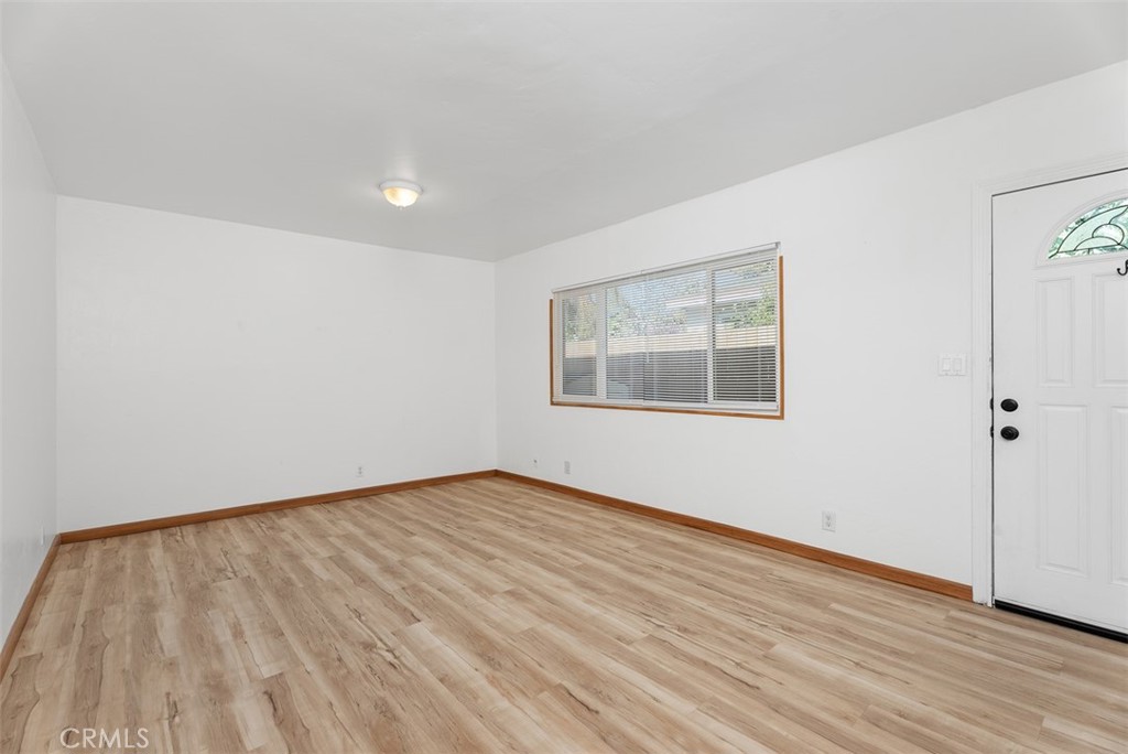 156 West Escalones San Clemente, CA 92672 - Photo 12 of 39 a view of an empty room with wooden floor and a window