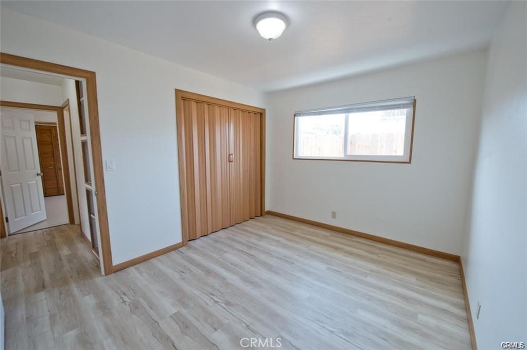 156 West Escalones San Clemente, CA 92672 - Photo 13 of 39 a view of an empty room with wooden floor and a window