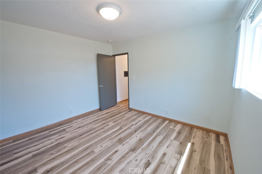 156 West Escalones San Clemente, CA 92672 - Photo 18 of 39 a view of an empty room with wooden floor and a window
